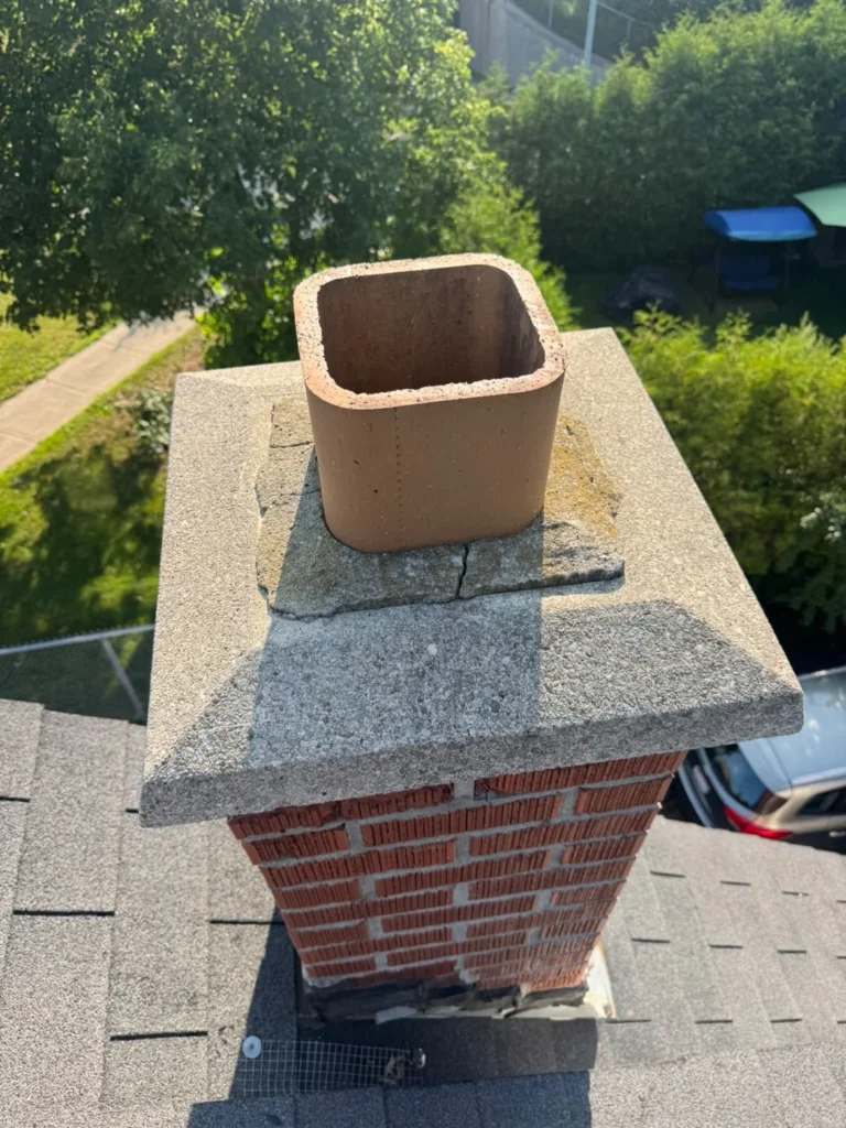 Open chimney flue before protective screening was installed.